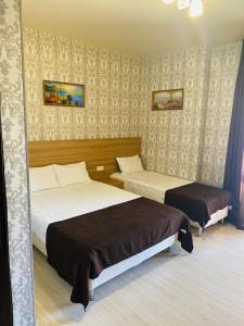 Giường trong phòng chung tại Inessa