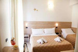 Postel nebo postele na pokoji v ubytování Hotel Costazzurra by Interlux