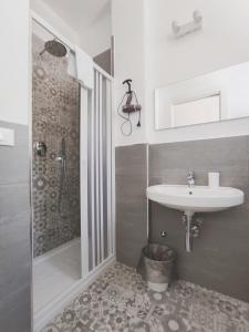 a bathroom with a sink and a shower at A Casa di Rosanna in Vieste