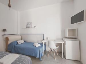 Un pat sau paturi într-o cameră la A Casa di Rosanna