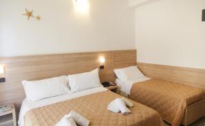 Postel nebo postele na pokoji v ubytování Hotel Costazzurra by Interlux