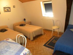 Tempat tidur dalam kamar di Le Noyer