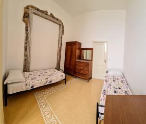 Postel nebo postele na pokoji v ubytování Salerno Experience Hostel