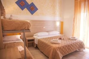 Postel nebo postele na pokoji v ubytování Hotel Costazzurra by Interlux + 37 fotografií