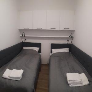 Ένα ή περισσότερα κρεβάτια σε δωμάτιο στο Apartament Kąty Rybackie Zaciszna