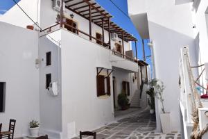 a street in the town of positano with white buildings at Naoussa Center Cycladic House in Kampos Paros