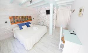 Postel nebo postele na pokoji v ubytování Hotel La Torre