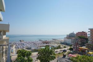 a city with a parking lot and the ocean at Hotel Bristol in Misano Adriatico