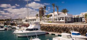 a group of boats docked in a marina at Casa Érika in Puerto del Rosario