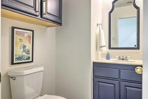 a bathroom with a toilet and a sink at Seguin Home on Lake Placid with Boat Dock! in Seguin +34 photos