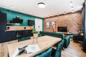 Televízia a/alebo spoločenská miestnosť v ubytovaní Modern Apartments Toruń 3 Stare Miasto-Centrum