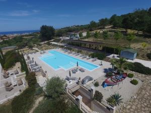 a beach area with a pool and a large building at Villa Sant'Angelo in Alba Adriatica