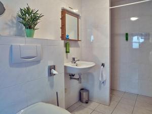 a bathroom with a toilet and a sink at Studio # Het Pauwennest in Den Bosch