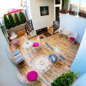 an aerial view of a patio with tables and chairs at Canti apartments in Novi Sad
