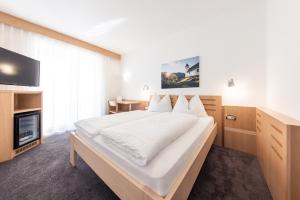 Postel nebo postele na pokoji v ubytování Mondschein Rooms + 20 fotografií
