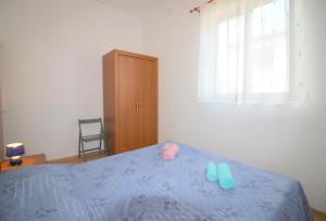Postel nebo postele na pokoji v ubytování Apartment Ema near city center