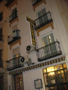 a building with balconies and lights on the side of it at Veracruz in Granada