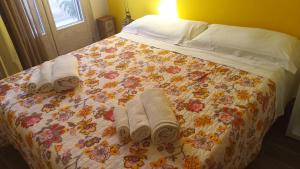 Een bed of bedden in een kamer bij B&B L'Antica Dimora ...e dei mestieri