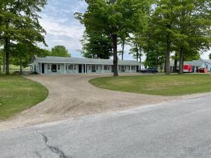 an empty road in front of a house at Pure Paradise Resort in Carp Lake