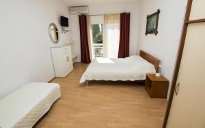 Postel nebo postele na pokoji v ubytování Apartment MERI (4172)