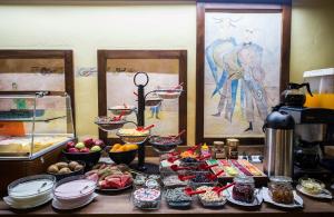 a table with many different food items on it at Hotel U Malého Vitka in Český Krumlov