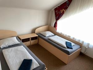 Un pat sau paturi într-o cameră la Žilina