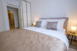 Posteľ alebo postele v izbe v ubytovaní MB Luxury Apartments