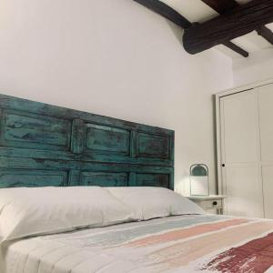 Ένα ή περισσότερα κρεβάτια σε δωμάτιο στο Trevignano Vecchio - Suite Apartment
