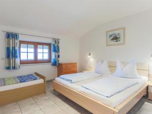 A bed or beds in a room at Koglbauer - Apartment Nr 4