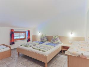 A bed or beds in a room at Koglbauer - Apartment Nr 4