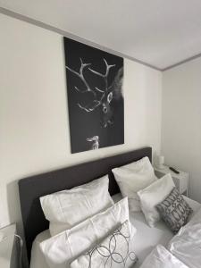 Un pat sau paturi într-o cameră la Appartement Max