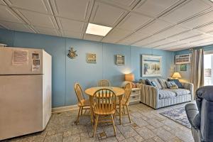 a living room with a table and chairs and a couch at Bright Dog-Friendly Escape with Direct Beach Access! in Ocean City