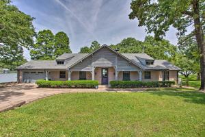 a house with a large yard in front of a house at Upscale Lakefront Texas Home Private Dock and Decks in Malakoff