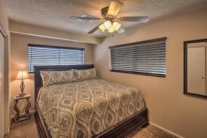 a bedroom with a bed and a ceiling fan at Cozy Couples Casita 2 Miles to Colorado River! in Bullhead City