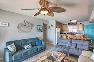 a living room with a couch and a ceiling fan at Cozy Middle Bass Island Getaway On Lake Eerie! in Put-in-Bay
