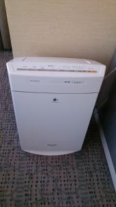 a white printer sitting in the corner of a room at Shibuya Excel Hotel Tokyu in Tokyo