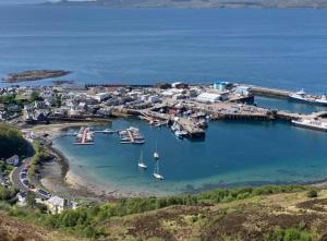 an aerial view of a harbor with boats in the water at Cornerstone in Mallaig