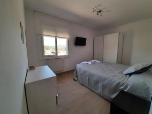 A bed or beds in a room at Ca l'Aren Cardona