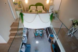 an overhead view of a room with a bed and a table at Le Radici Accomodation in Tropea