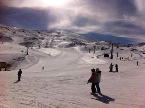 a group of people on a snow covered ski slope at Las Terrazas del Jardin Nazari B41 in Vélez de Benaudalla