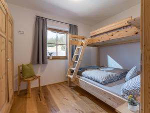 A bed or beds in a room at Bauernhof Streitenau