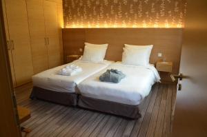 Postel nebo postele na pokoji v ubytování Hotel Bon Repos