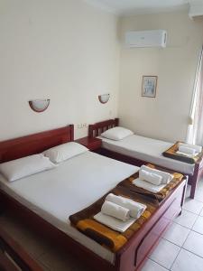 Ένα ή περισσότερα κρεβάτια σε δωμάτιο στο Glaros