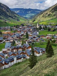 a small town in a valley with houses at Haus am Wörtherberg in Rauris