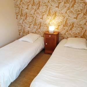 Кровать или кровати в номере Gites et Spa - Manoir des Falaises