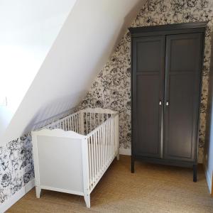Кровать или кровати в номере Gites et Spa - Manoir des Falaises
