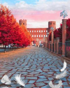 a cobblestone street in front of a large building at B&B Carlo Alberto in Turin