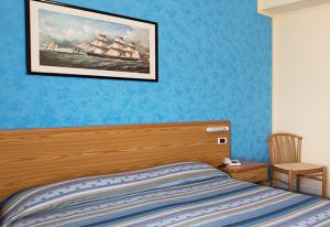 Postel nebo postele na pokoji v ubytování Hotel Parthenius Cirella di Diamante