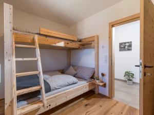 A bed or beds in a room at Bauernhof Streitenau