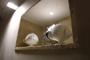 two white vases sitting on a shelf in a room at LA DIMORA DEL PRINCIPE-Loft in Trani
